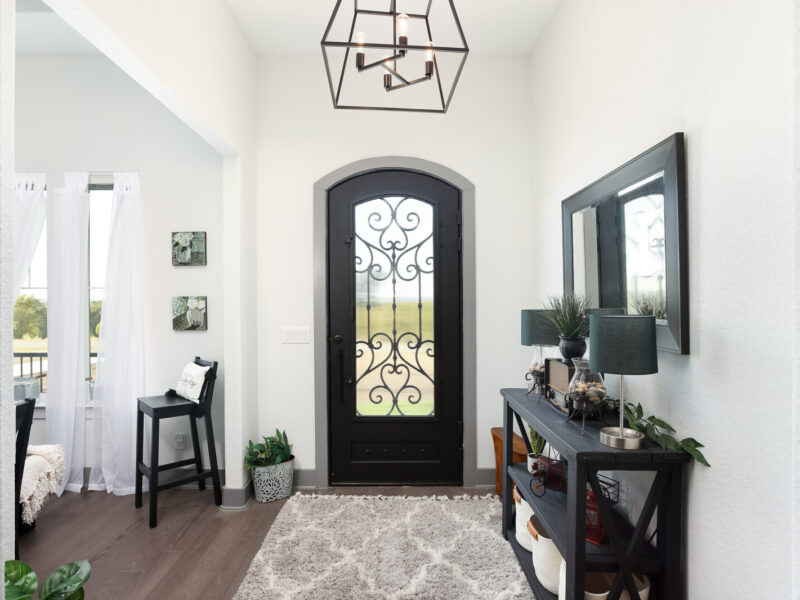 Entry hall with decorative iron front door in The Ridge