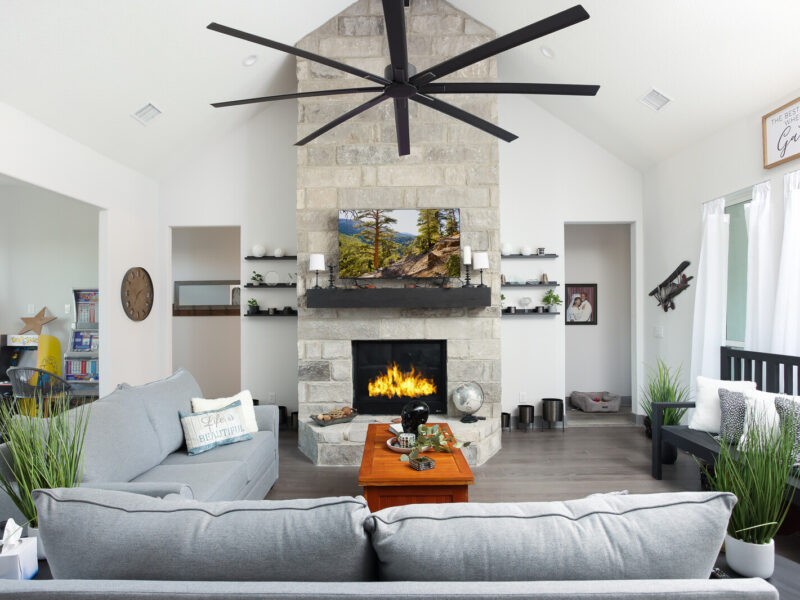 Living room seating around the stone fireplace