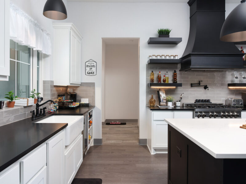 Kitchen counters, open shelves and range hood