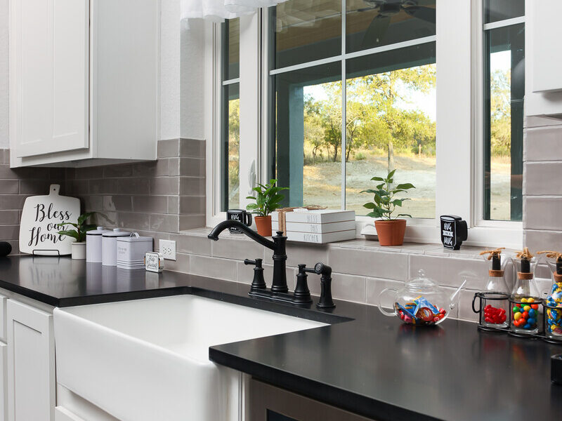 Kitchen sink beneath a window in The Ridge