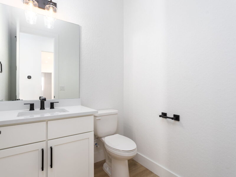 Bathroom vanity and toilet in The Peak
