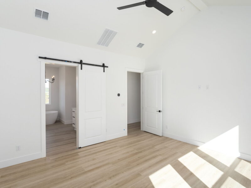 Bedroom with a sliding barn door