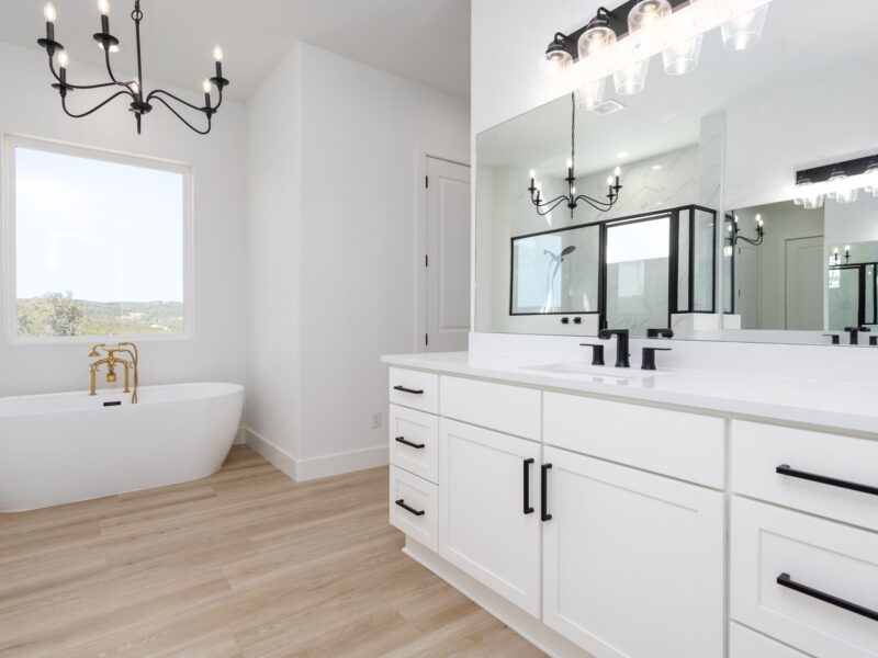 Freestanding tub and double vanity in The Peak bathroom