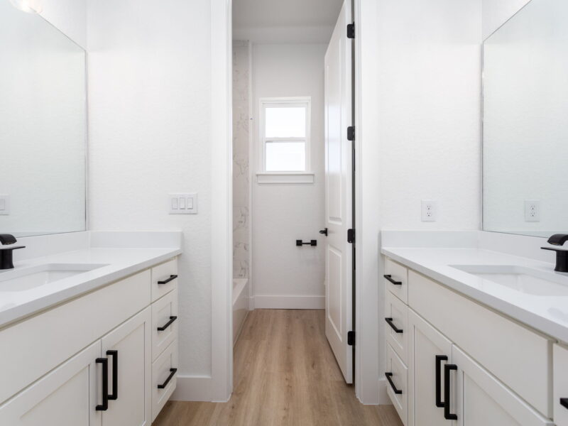 Bathroom vanity and doorway in The Peak