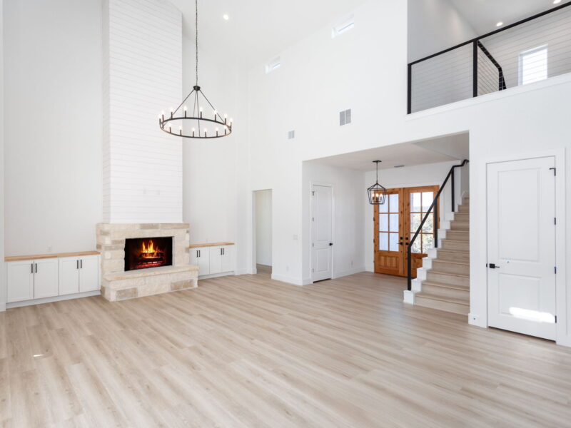 Living room with a fireplace and staircase