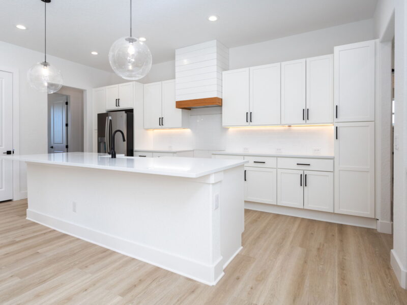 White kitchen and broad center island