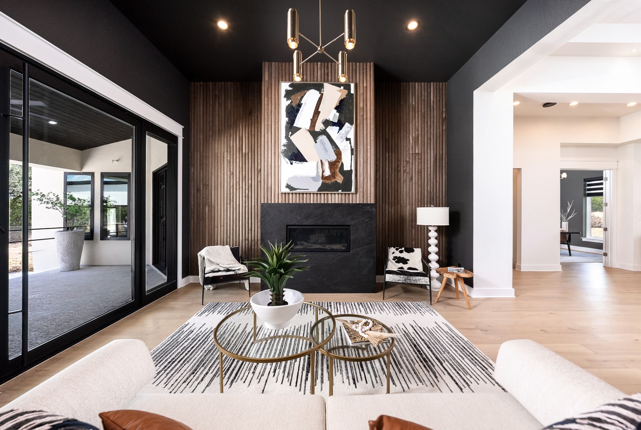 Living room with a fireplace and wood feature wall