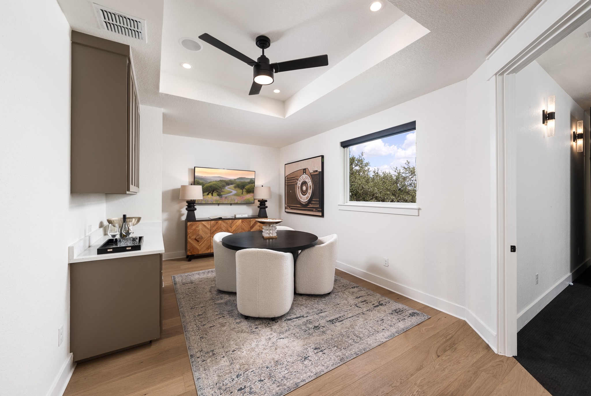 Game room with a round table and beverage counter